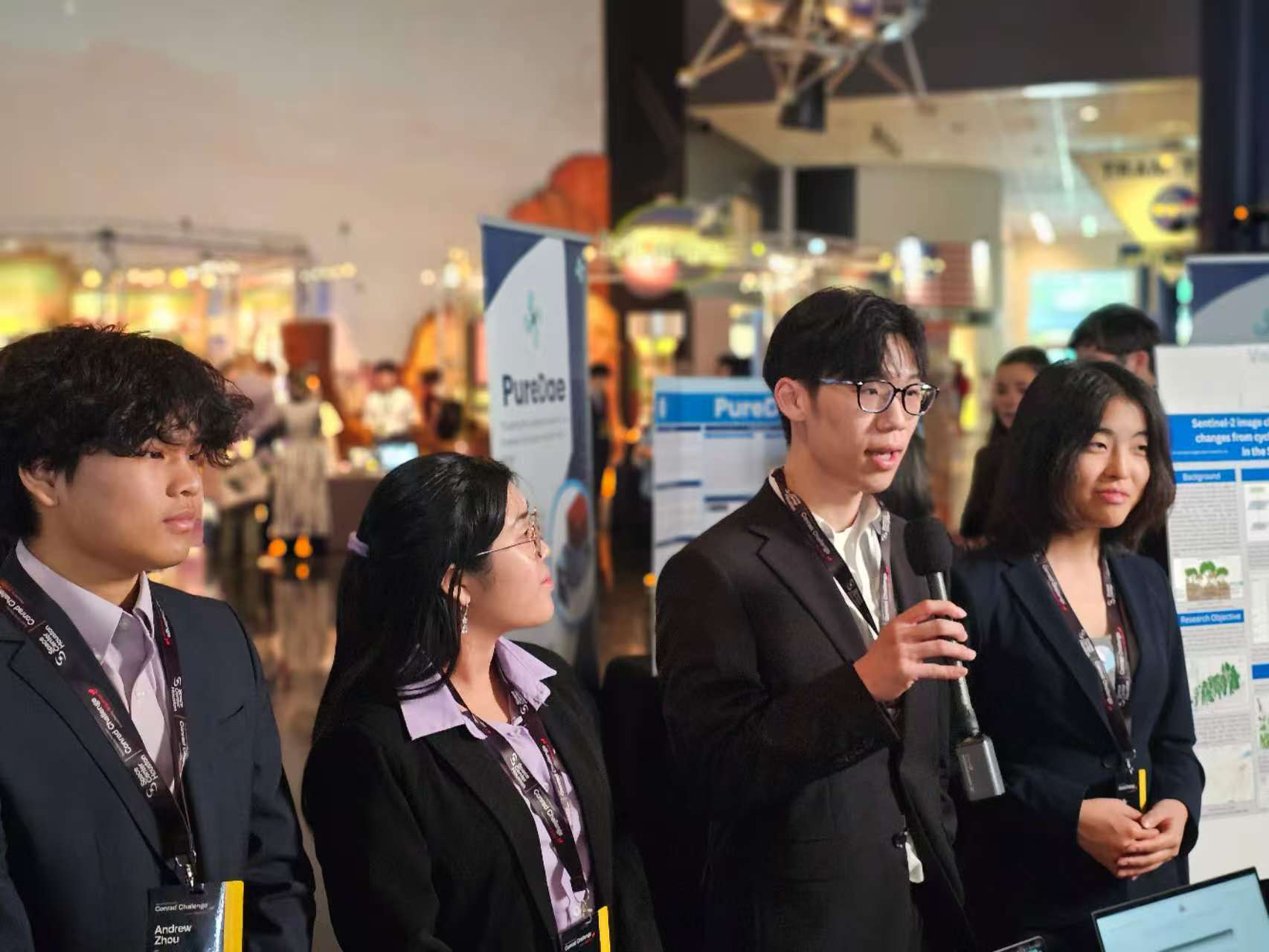 Team presenting at exhibition booth